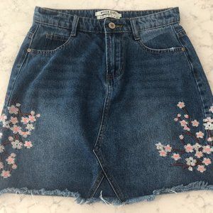 High waisted denim mini skirt w/ embroidered cherry blossoms